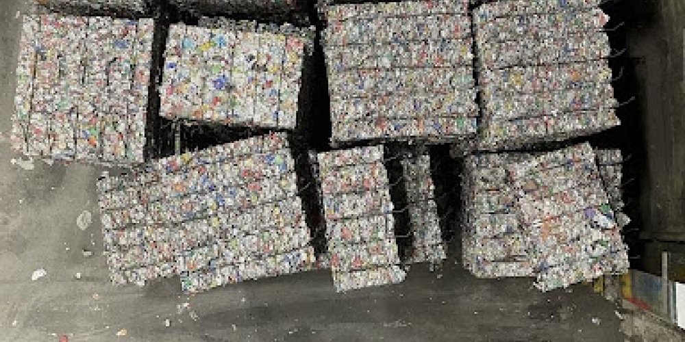 Bales of recycled aluminum cans at a Materials Recycling Facility (MRF) ready to be sold and manufactured into new aluminum goods.